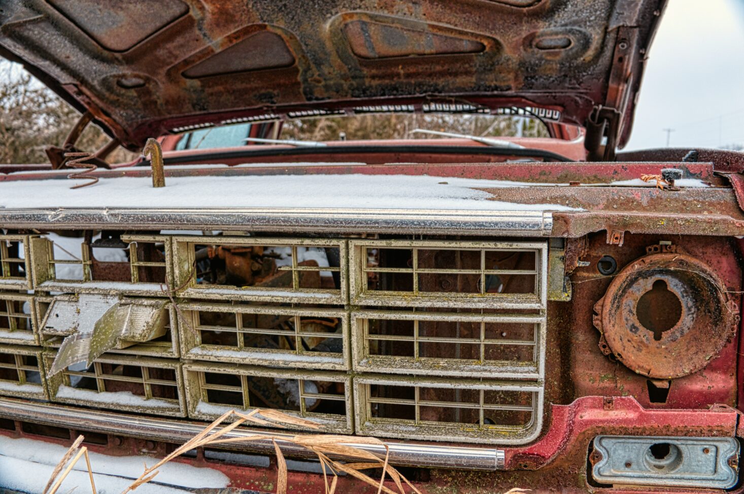 hood open on a rusty used truck