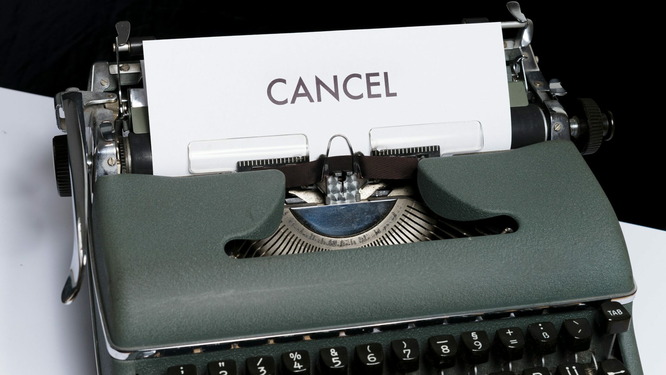 typewriter with the word cancel on it